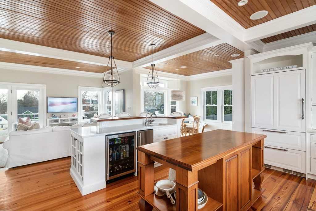 4 Mann Street Hingham, MA 02043 - Photo 6 of 22 a kitchen with a stove a refrigerator and wooden cabinets