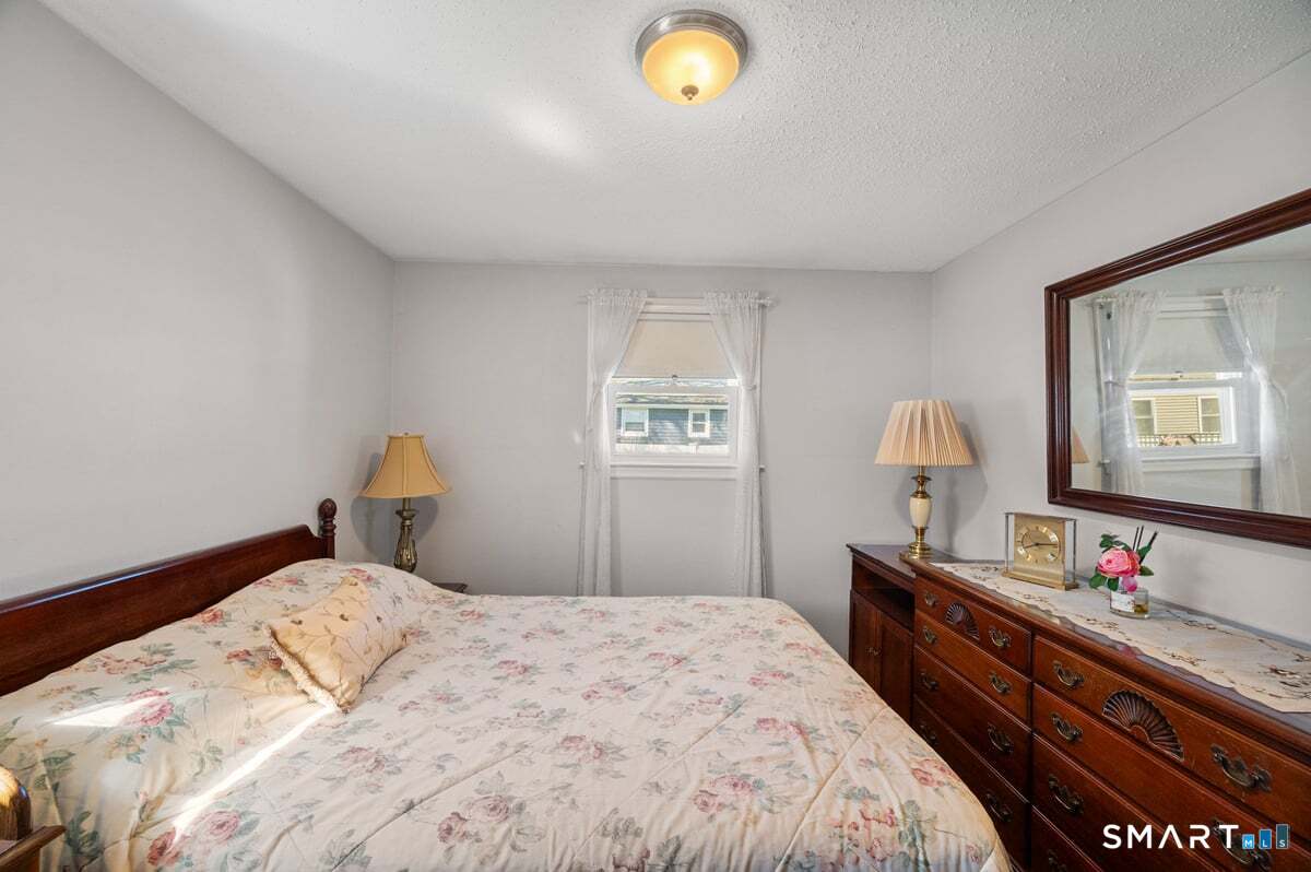 21 Brookside Circle Wethersfield, CT 06109 - Photo 11 of 39 a bedroom with bed and window
