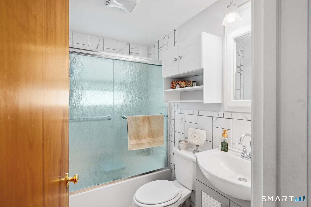 21 Brookside Circle Wethersfield, CT 06109 - Photo 12 of 39 a bathroom with a sink toilet and shower