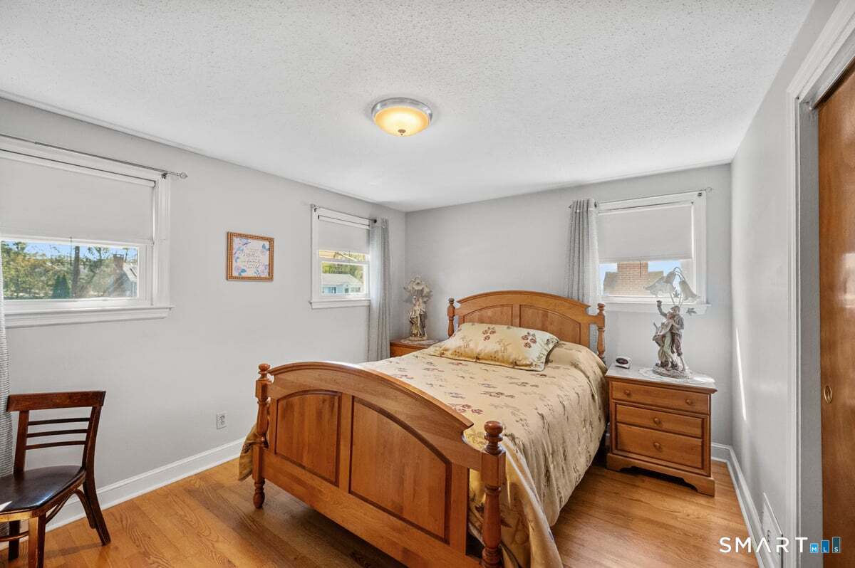 21 Brookside Circle Wethersfield, CT 06109 - Photo 13 of 39 a bedroom with a bed and a window