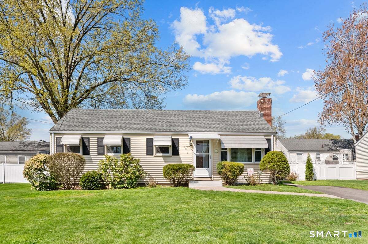 21 Brookside Circle Wethersfield, CT 06109 - Photo 3 of 39 a front view of a house with a garden