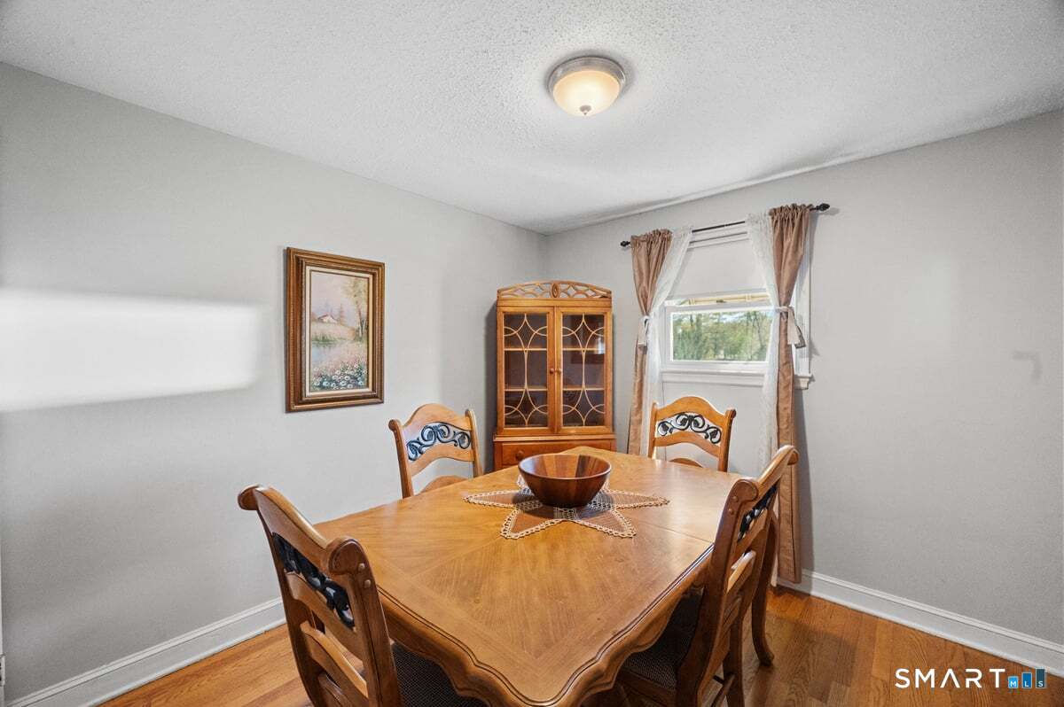 21 Brookside Circle Wethersfield, CT 06109 - Photo 8 of 39 a view of a dining room with furniture and window