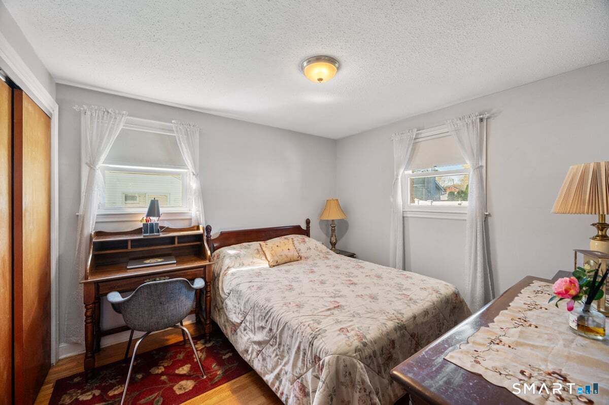 21 Brookside Circle Wethersfield, CT 06109 - Photo 10 of 39 a bedroom with a bed and a window
