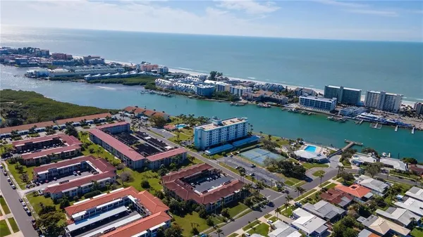 an aerial view of a houses with a lake view