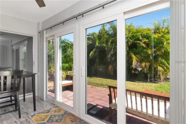 a view of a porch with a furniture and garden