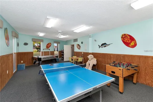 a room with furniture and air hockey table