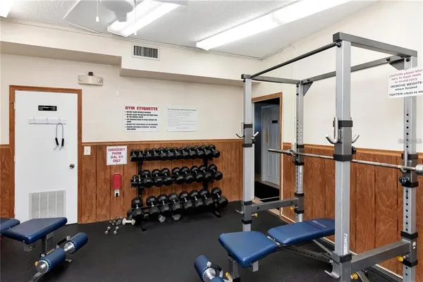 a room with gym equipment and a window