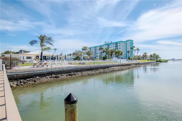 a view of a swimming pool with an outdoor seating