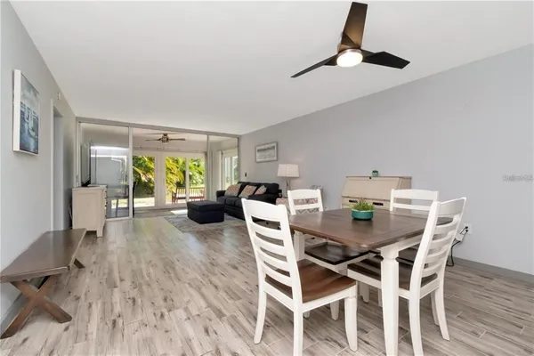 a view of a dining room with furniture and a window