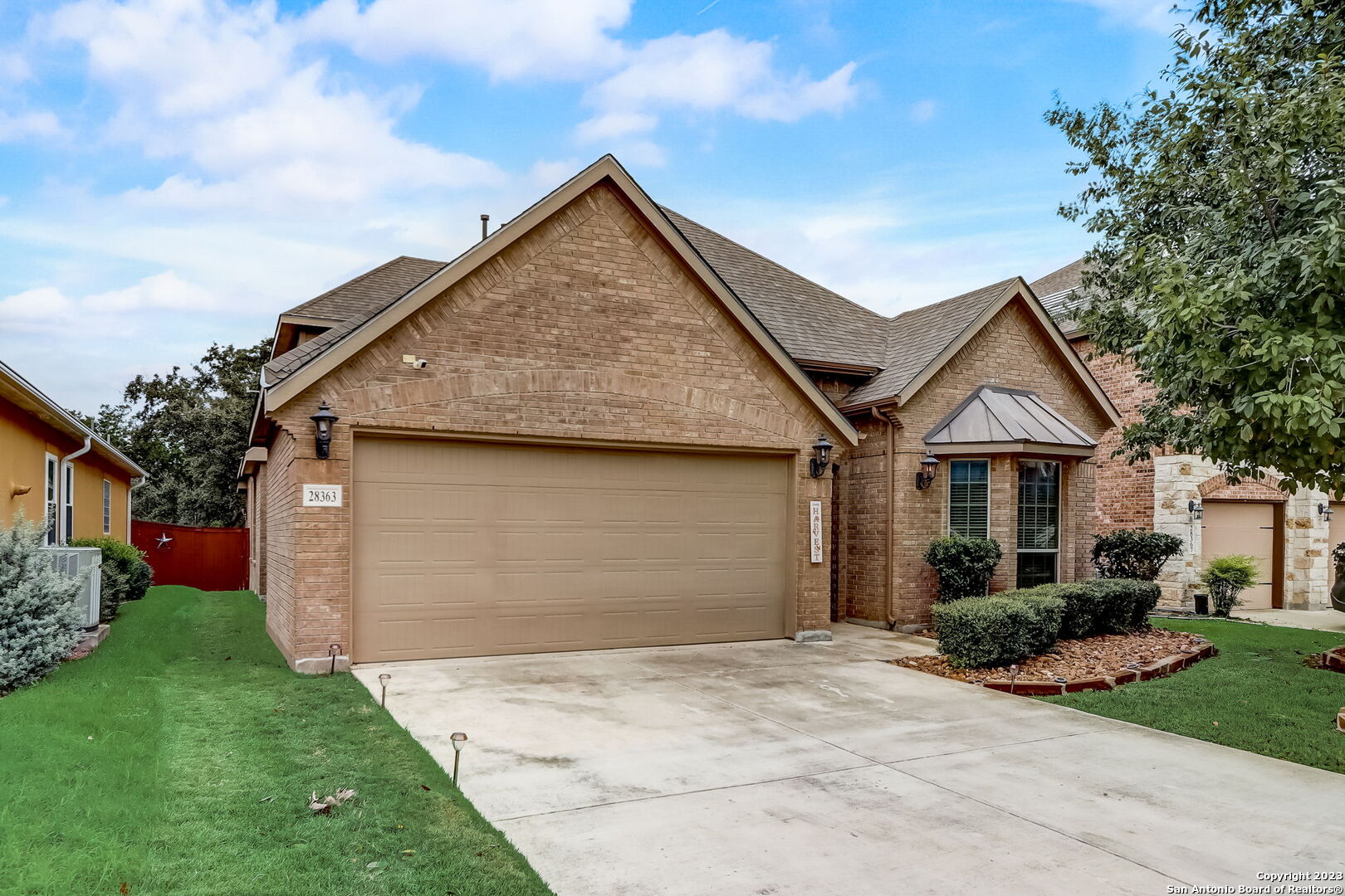 28363 Willis Ranch San Antonio, TX 78260 - Photo 1 of 1 a front view of a house with a yard and garage