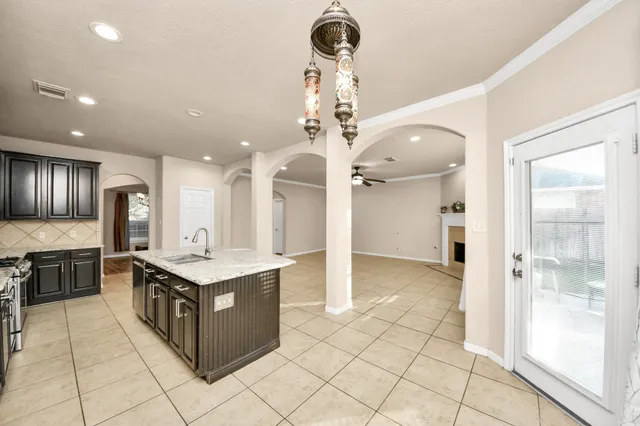 a kitchen with stainless steel appliances granite countertop a stove and a refrigerator
