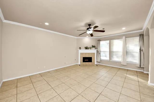 a view of an empty room with a fireplace