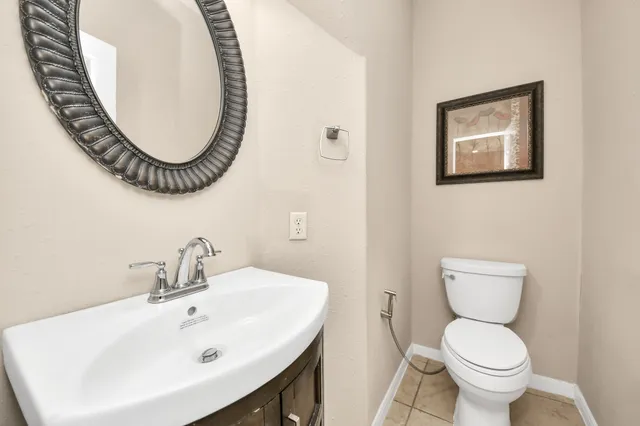 a bathroom with a toilet and a sink