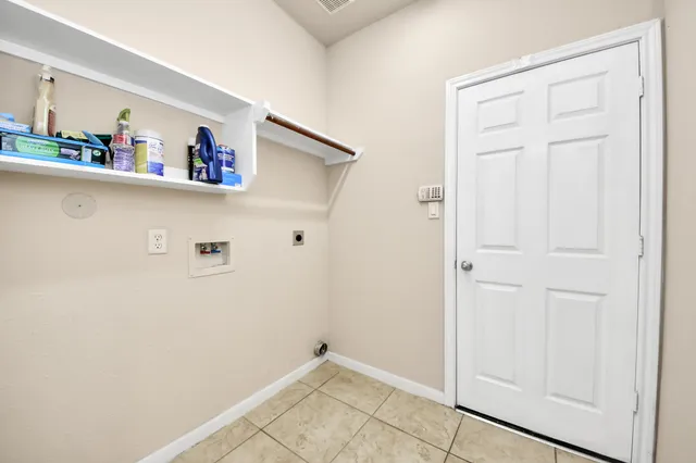 a view of kitchen with cabinets