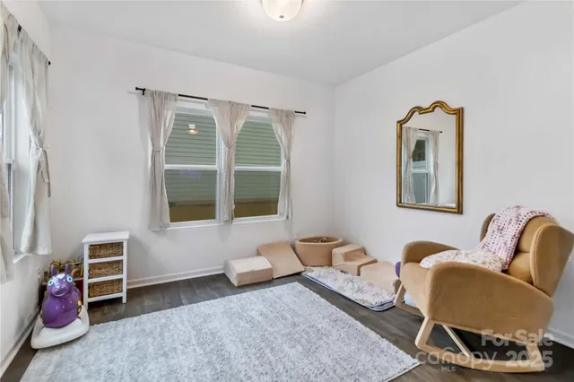 a bedroom with furniture and a window