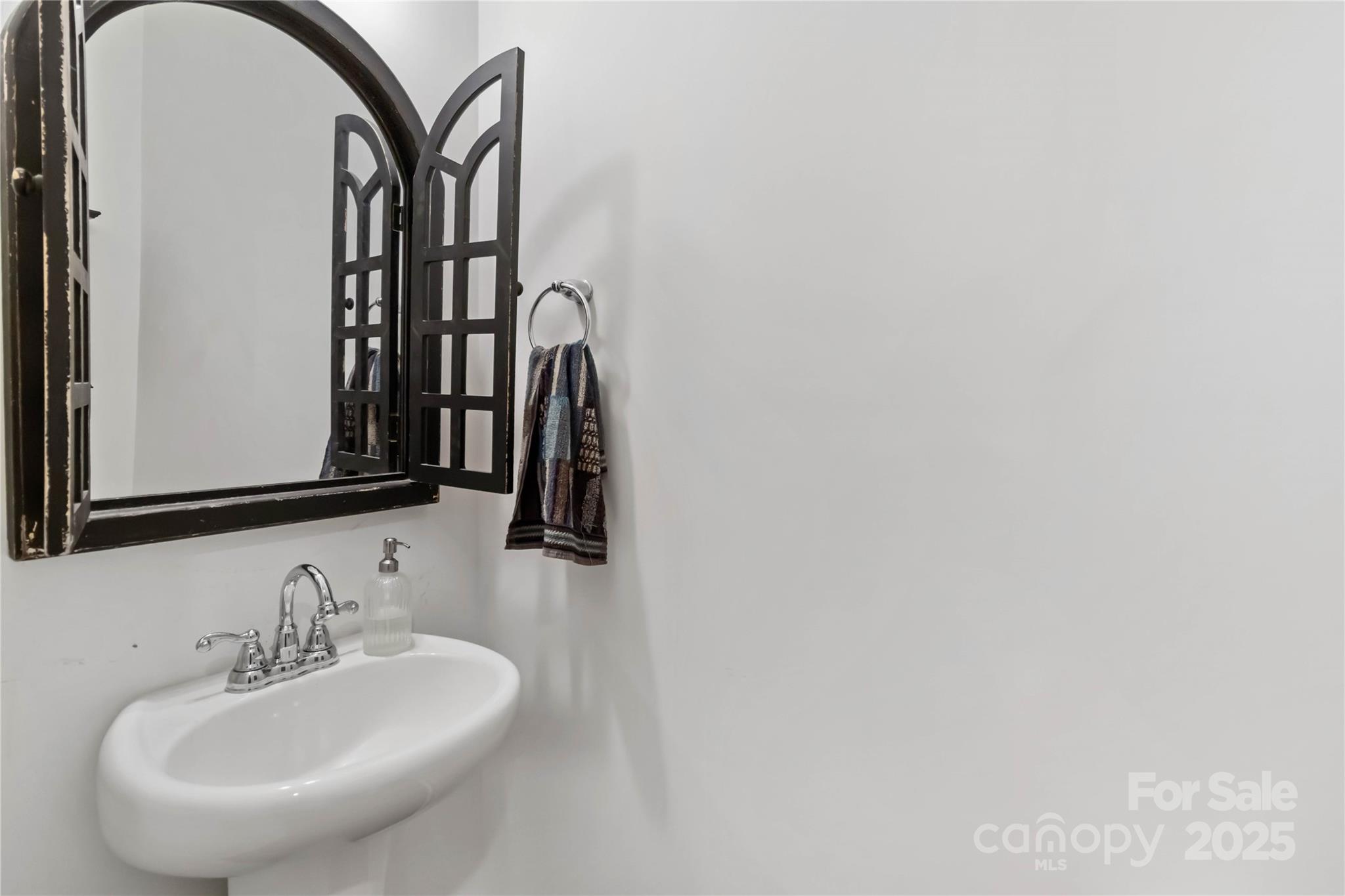 684 Candela Court York, SC 29745 - Photo 17 of 28 a bathroom with a sink and a mirror