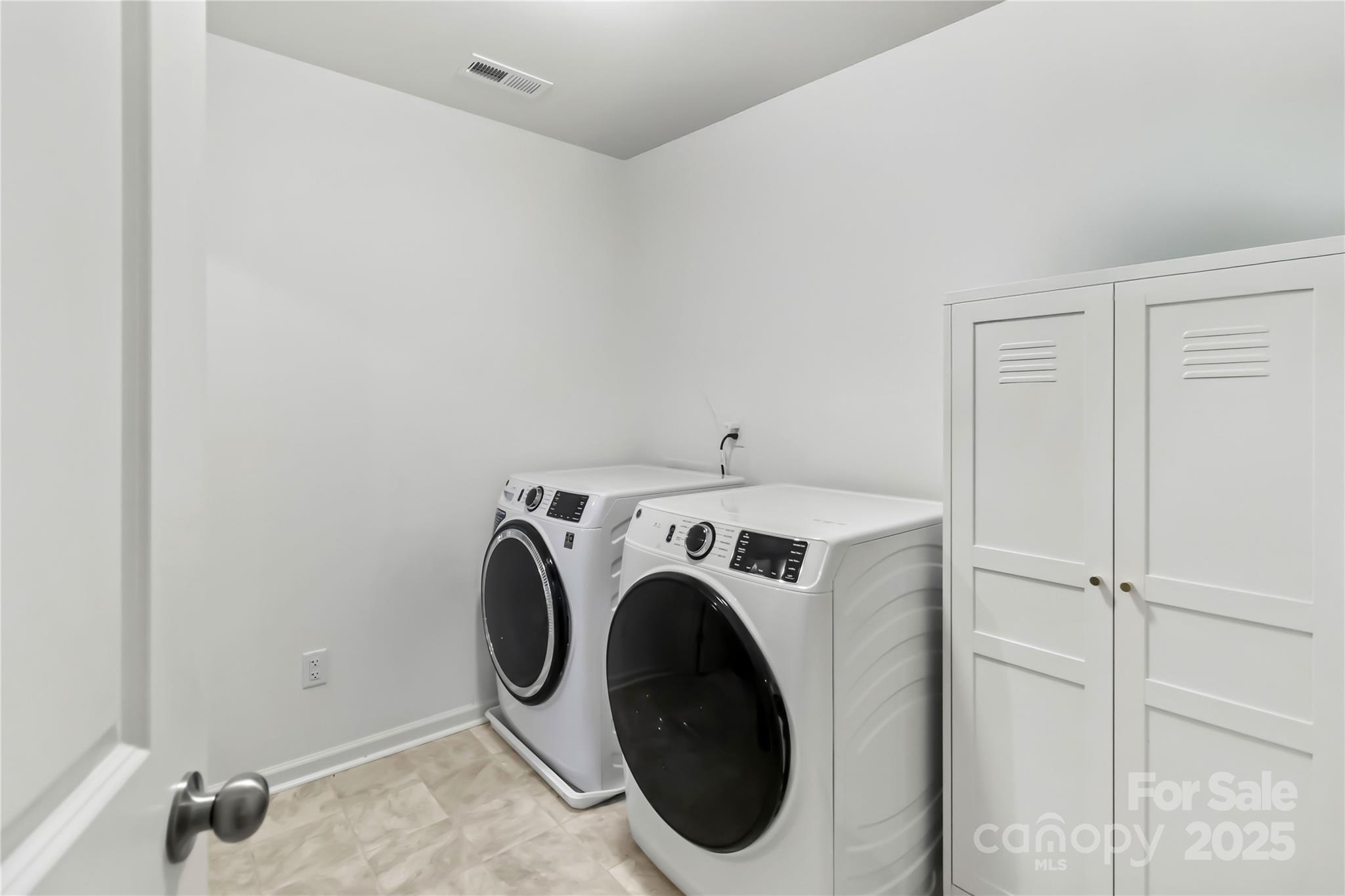 684 Candela Court York, SC 29745 - Photo 23 of 28 a utility room with dryer and washer