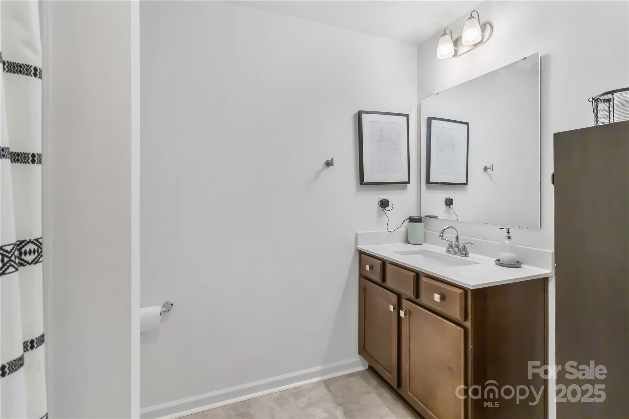 684 Candela Court York, SC 29745 - Photo 25 of 28 a bathroom with a sink and a mirror