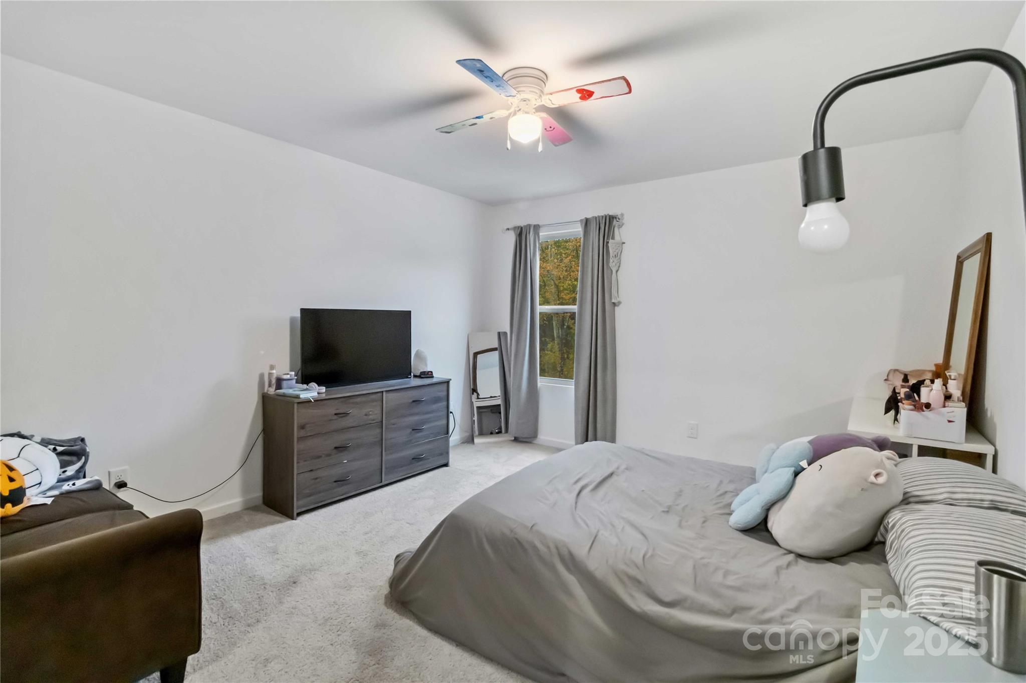 684 Candela Court York, SC 29745 - Photo 27 of 28 a bedroom with a bed and a flat screen tv