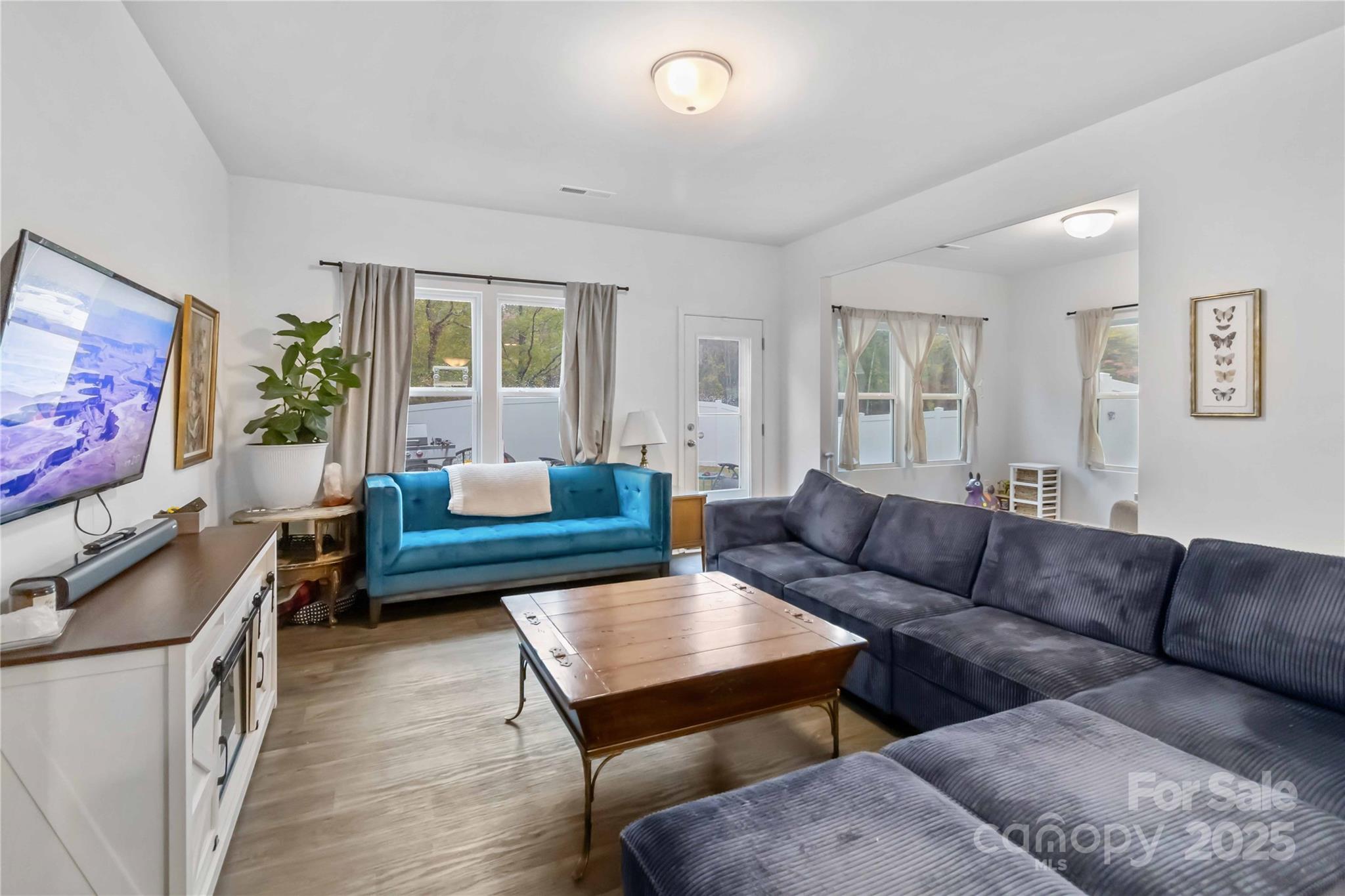 684 Candela Court York, SC 29745 - Photo 10 of 28 a living room with furniture a flat screen tv and a couch