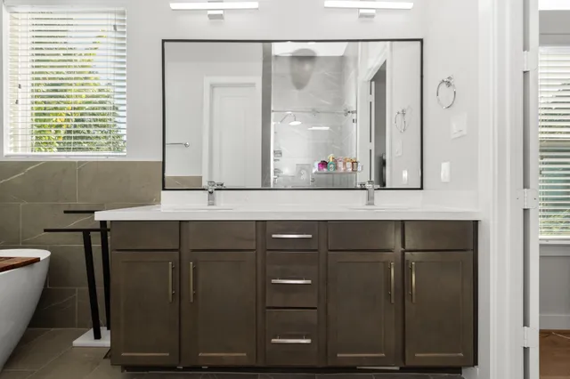 a bathroom with a sink and a mirror