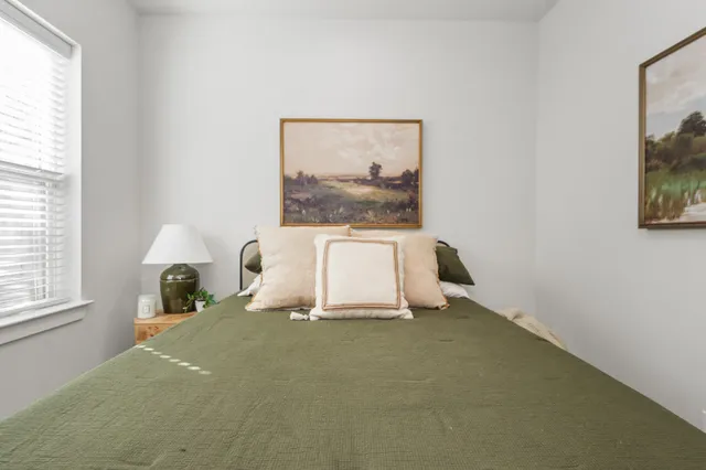 a room with a bed and a window