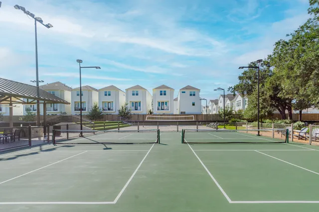 a view of houses with a swimming pool