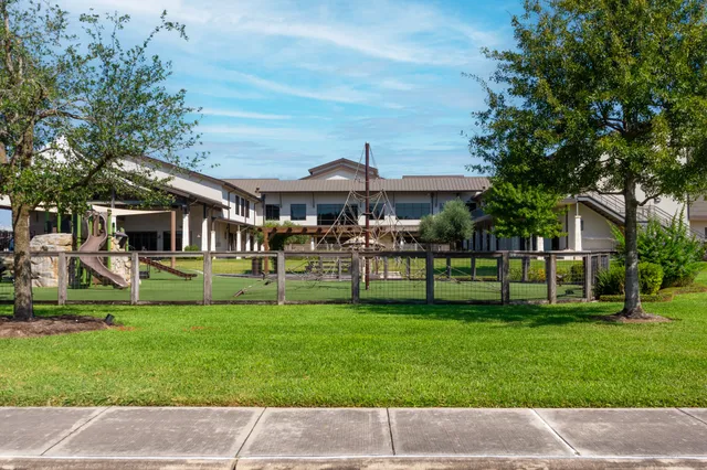 a front view of a house with a yard table and chairs