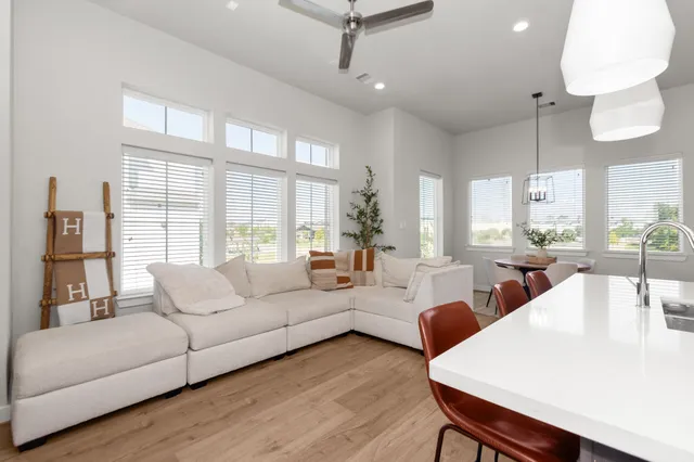 a living room with furniture and a large window