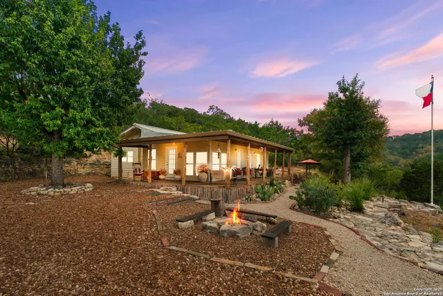 a view of a house with a yard porch and sitting area
