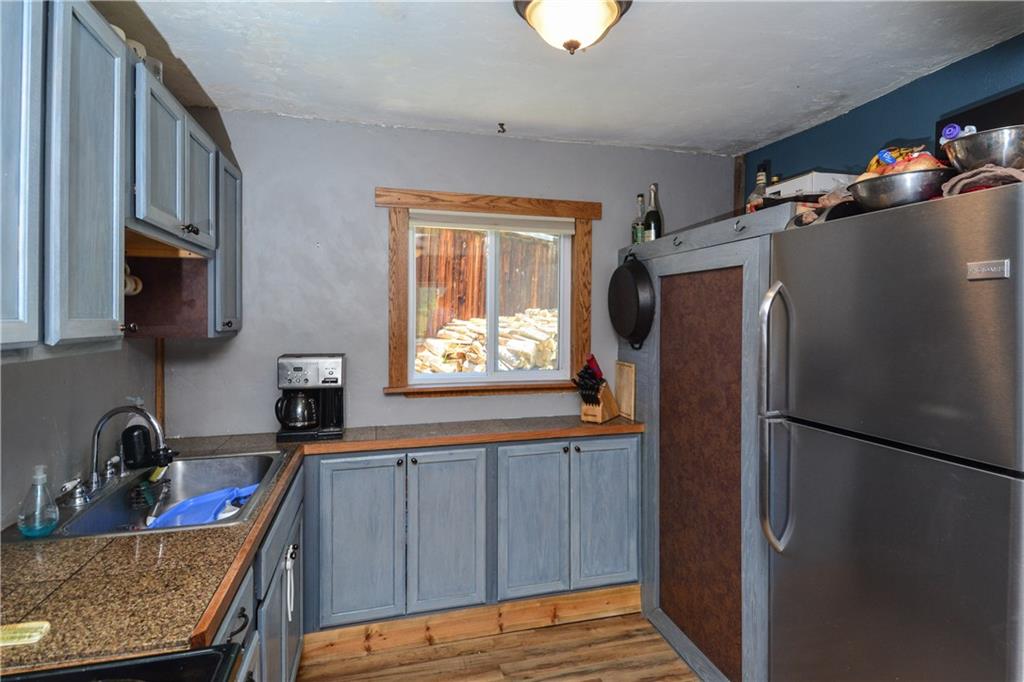 89 V Road Silverthorne, CO 80498 - Photo 4 of 25 a kitchen with stainless steel appliances granite countertop a refrigerator and a sink