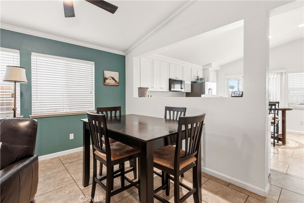 1478 La Sierra Street Merced, CA 95348 - Photo 14 of 32 a view of a dining room with furniture and window