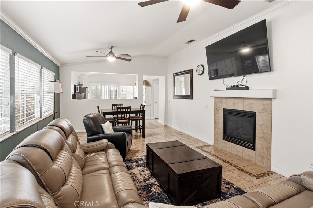 1478 La Sierra Street Merced, CA 95348 - Photo 15 of 32 a living room with furniture and a flat screen tv