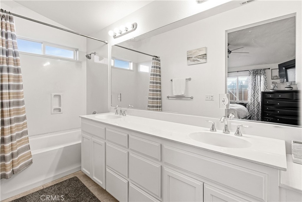 1478 La Sierra Street Merced, CA 95348 - Photo 18 of 32 a bathroom with a sink double vanity granite tub shower and a mirror