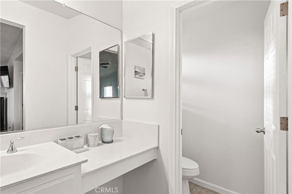 1478 La Sierra Street Merced, CA 95348 - Photo 19 of 32 a bathroom with a sink and a mirror