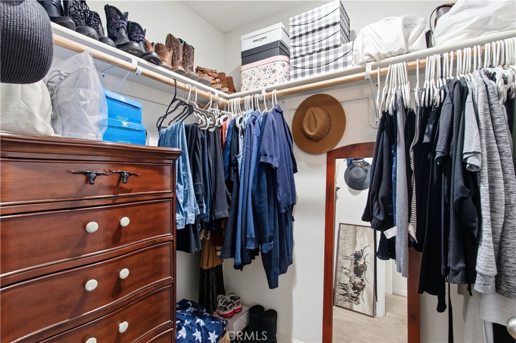 1478 La Sierra Street Merced, CA 95348 - Photo 21 of 32 a view of walk in closet with clothes and shoes