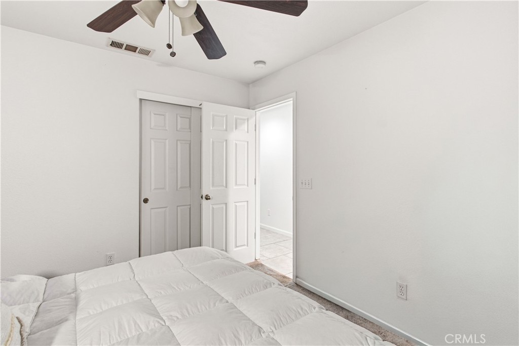 1478 La Sierra Street Merced, CA 95348 - Photo 28 of 32 a view of a livingroom with a ceiling fan & window