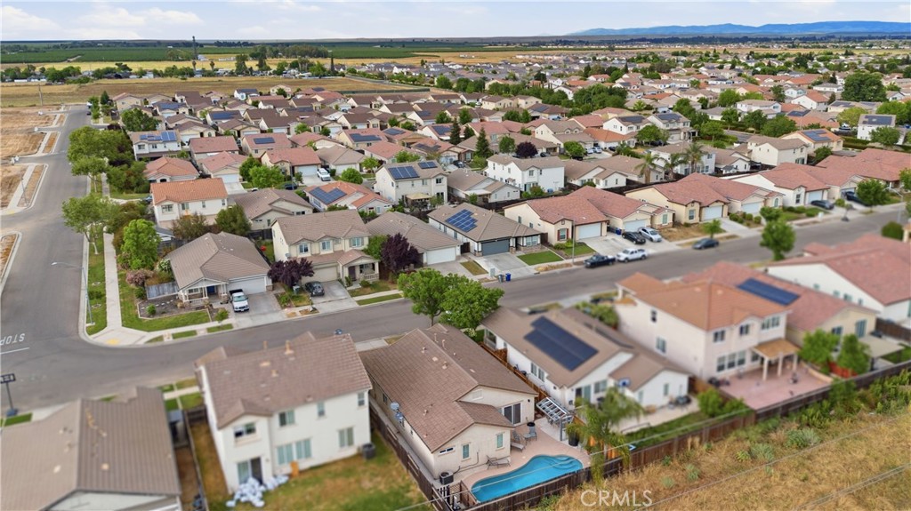 1478 La Sierra Street Merced, CA 95348 - Photo 31 of 32 an aerial view of residential houses with outdoor space