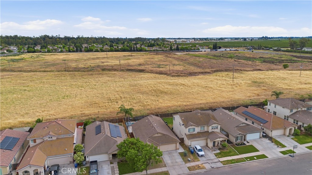 1478 La Sierra Street Merced, CA 95348 - Photo 32 of 32 an aerial view of residential building with outdoor space and lake view
