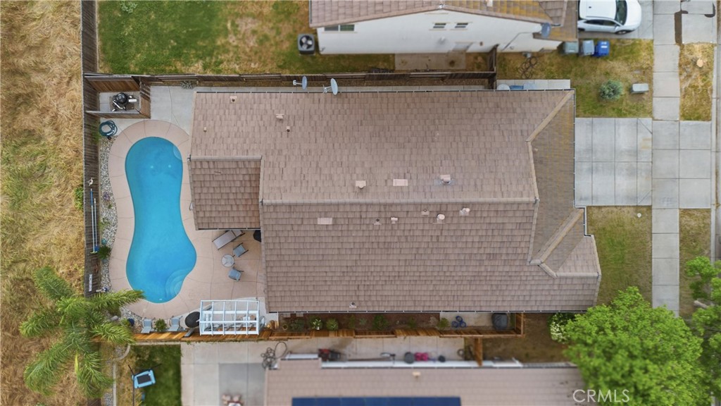 1478 La Sierra Street Merced, CA 95348 - Photo 5 of 32 a aerial view of a house with a garden and plants