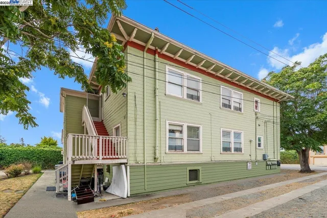 a front view of a house with a yard and a garage