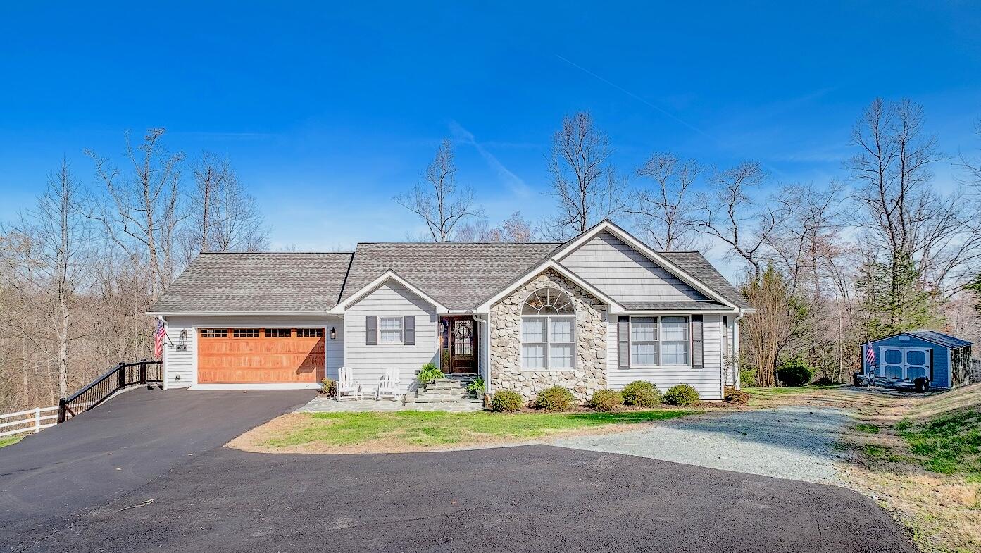 a front view of a house with a yard and porch