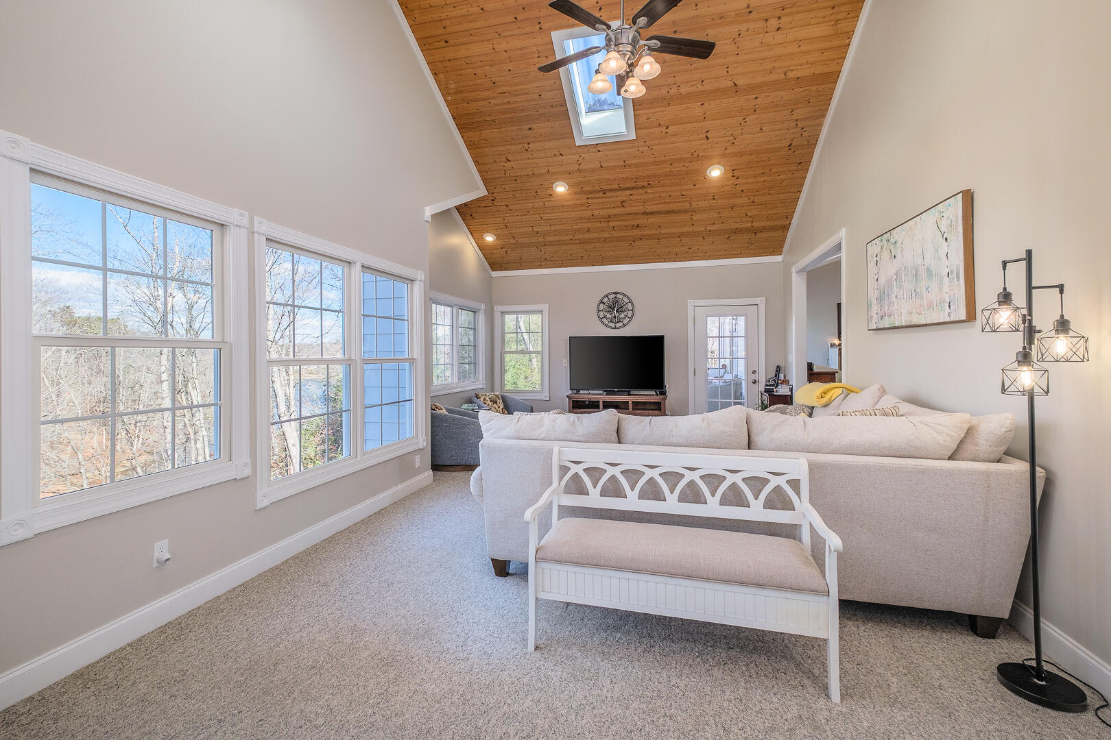 2085 Lakewood Forest Road Moneta, VA 24121 - Photo 15 of 76 a spacious bedroom with a large bed and a chandelier