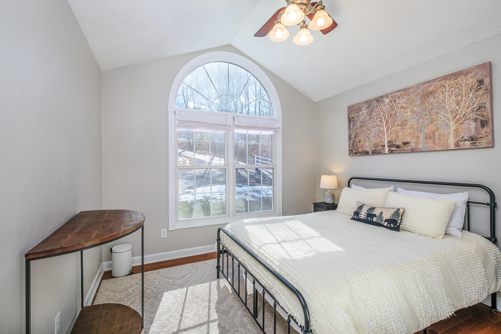 2085 Lakewood Forest Road Moneta, VA 24121 - Photo 27 of 76 a bedroom with a large bed and a chandelier