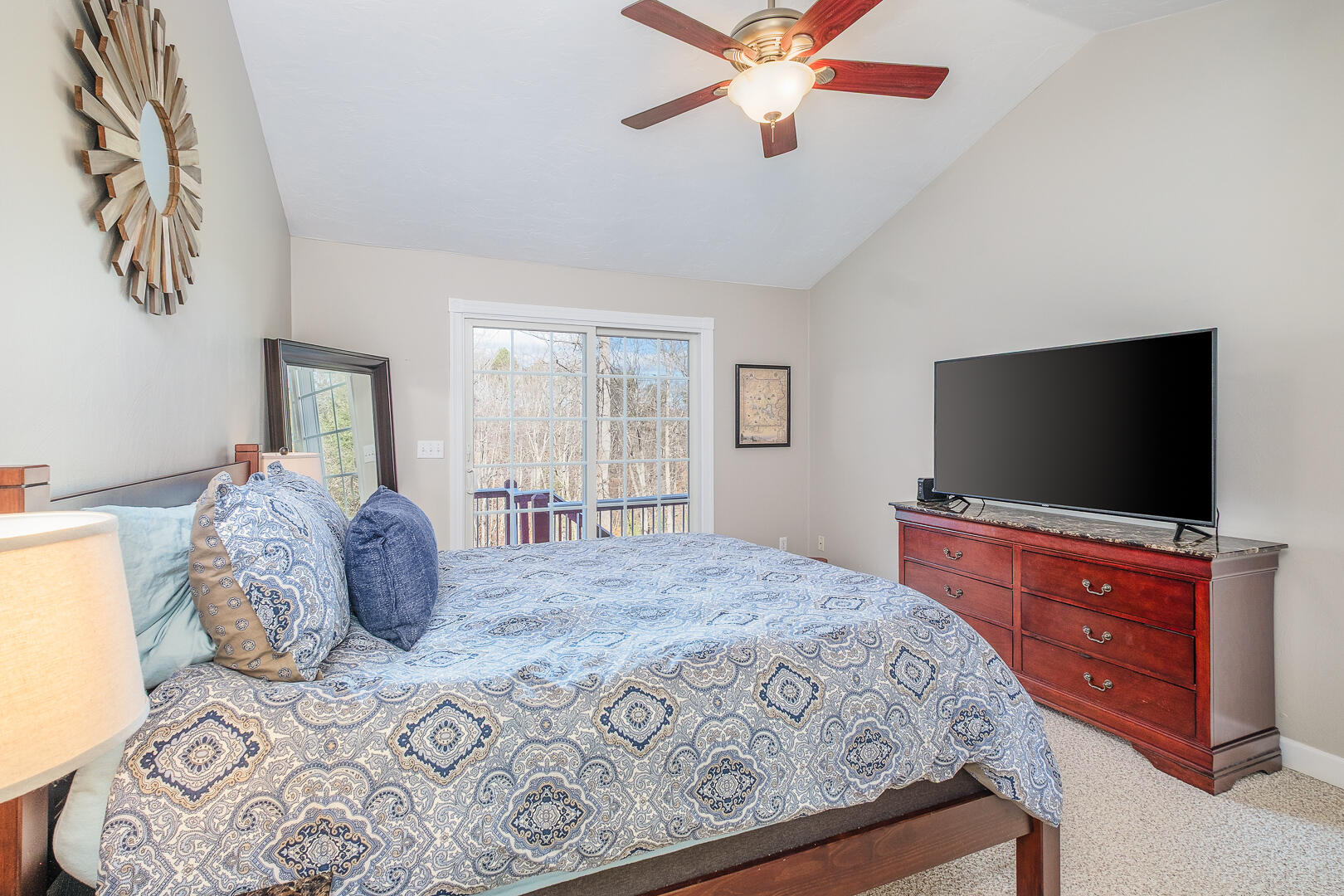 2085 Lakewood Forest Road Moneta, VA 24121 - Photo 32 of 76 a bedroom with a large bed and a flat screen tv