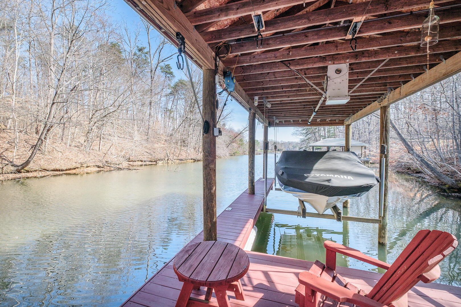 2085 Lakewood Forest Road Moneta, VA 24121 - Photo 4 of 76 a balcony with table and chairs with wooden floor and fence