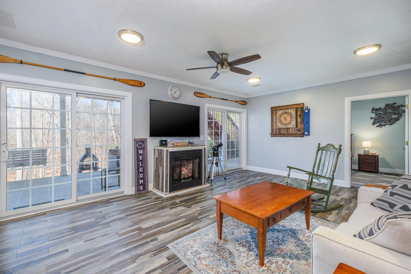 2085 Lakewood Forest Road Moneta, VA 24121 - Photo 43 of 76 a living room with furniture a flat screen tv and a fireplace