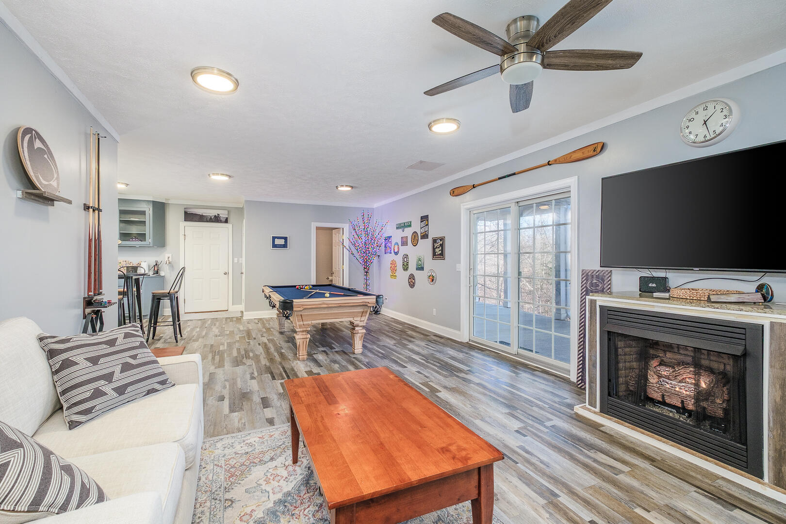 2085 Lakewood Forest Road Moneta, VA 24121 - Photo 44 of 76 a living room with furniture a flat screen tv and a fireplace