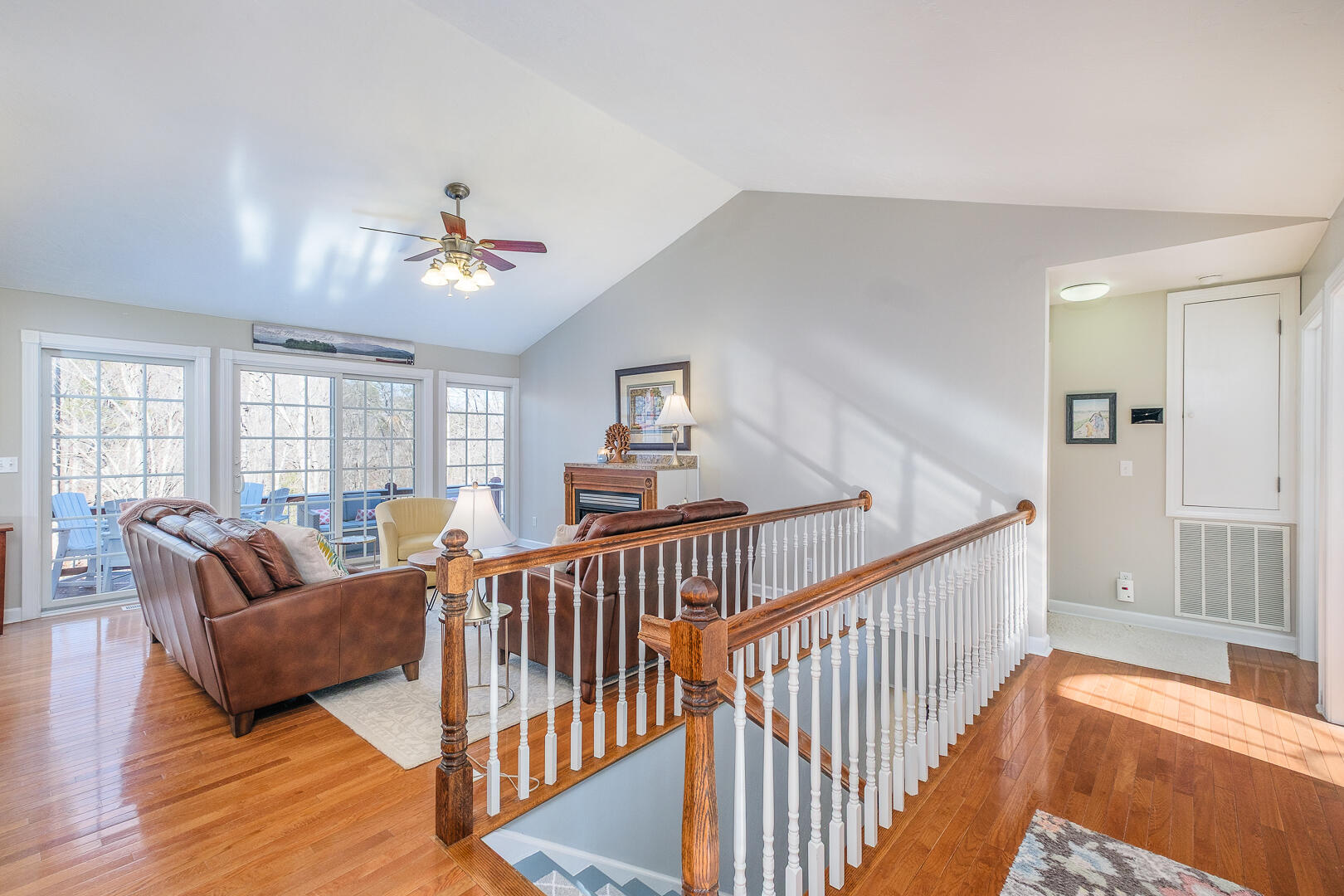 2085 Lakewood Forest Road Moneta, VA 24121 - Photo 8 of 76 a living room with furniture stairs and a chandelier