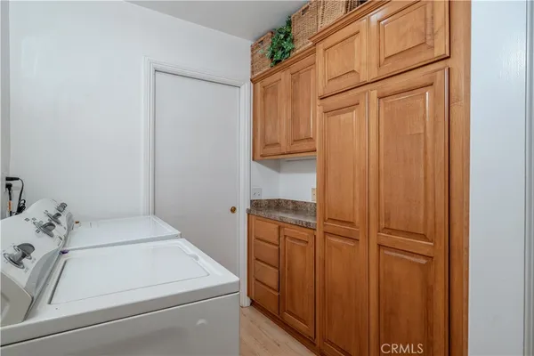 an empty room with furniture and wooden floor